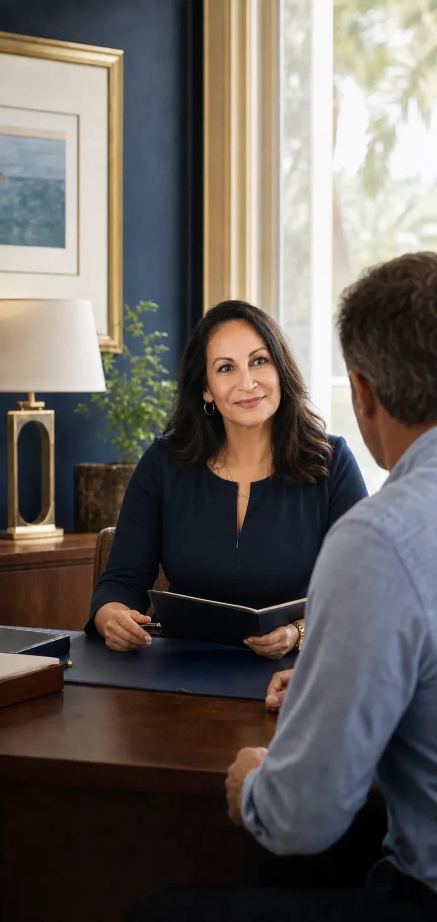 Mary Colina-Fowler listening to a client during a personal injury consultation