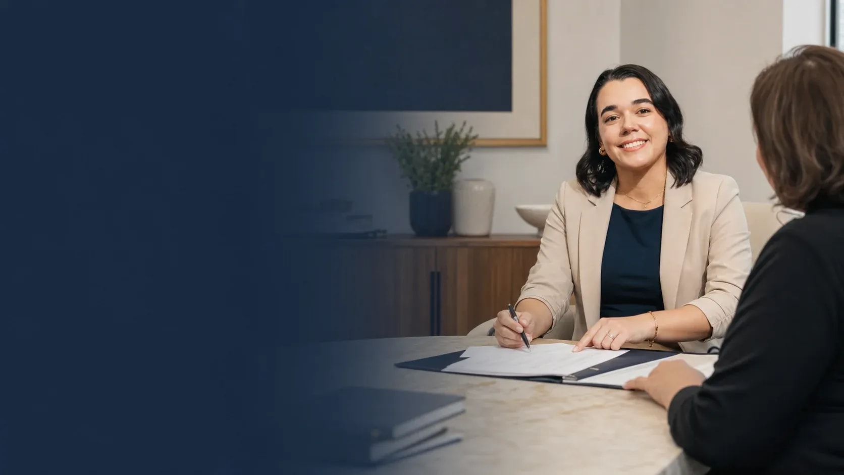 Colina Law team member guiding a client through closing documents
